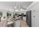 Bright kitchen boasts granite countertops, stainless steel appliances, and an island with seating at 4214 Palacio Dr, Sarasota, FL 34238