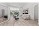 Open living area with white sofa, pool view, and high ceilings at 4214 Palacio Dr, Sarasota, FL 34238