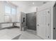 Bathroom with walk-in shower, built in bench, and modern vanity at 4214 Palacio Dr, Sarasota, FL 34238