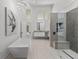 Spa-like bathroom with soaking tub, walk-in shower, and modern vanity at 4214 Palacio Dr, Sarasota, FL 34238