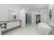Modern bathroom with soaking tub, walk-in shower, and double vanity at 4214 Palacio Dr, Sarasota, FL 34238