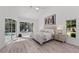 Main bedroom with pool view, sliding glass doors, and light flooring at 4214 Palacio Dr, Sarasota, FL 34238
