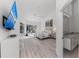 Spacious main bedroom with sliding doors to pool area, large TV and ensuite bathroom at 4214 Palacio Dr, Sarasota, FL 34238