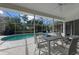 Inviting pool area with screened patio and seating at 4214 Palacio Dr, Sarasota, FL 34238