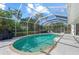 Relaxing pool and patio area with screened enclosure at 4214 Palacio Dr, Sarasota, FL 34238