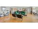 Bright living room with hardwood floors, green sofa, and large windows at 435 S Gulfstream Ave # 604, Sarasota, FL 34236