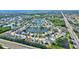 Aerial view of a community with lake and houses at 4440 Sanibel Way, Bradenton, FL 34203