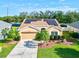 Single-Gathering home with solar panels and attractive landscaping at 4440 Sanibel Way, Bradenton, FL 34203