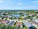 Aerial view of community with lake and many houses at 4440 Sanibel Way, Bradenton, FL 34203