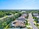 Aerial view of residential neighborhood with houses and street at 4440 Sanibel Way, Bradenton, FL 34203
