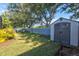 Spacious backyard with storage shed and grassy area at 4440 Sanibel Way, Bradenton, FL 34203