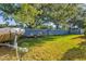 Green grassy backyard with shed and boat storage at 4440 Sanibel Way, Bradenton, FL 34203