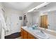 Double vanity and large mirror in this double-sink bathroom at 4440 Sanibel Way, Bradenton, FL 34203