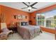 Bedroom with a leopard print comforter and ceiling fan at 4440 Sanibel Way, Bradenton, FL 34203
