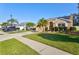 Two-story house with a spacious yard and palm trees at 4440 Sanibel Way, Bradenton, FL 34203