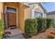 Inviting front door entry with a welcome sign and neatly trimmed hedges at 4440 Sanibel Way, Bradenton, FL 34203