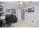 Bright home office features built-in shelving, desk, and comfortable chair at 4440 Sanibel Way, Bradenton, FL 34203