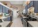 Modern kitchen with stainless steel appliances and ample counter space at 4440 Sanibel Way, Bradenton, FL 34203