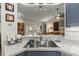Kitchen features a breakfast bar and views into the living room at 4440 Sanibel Way, Bradenton, FL 34203
