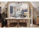 Kitchen with breakfast bar, stainless steel appliances, and dark blue cabinets at 4440 Sanibel Way, Bradenton, FL 34203