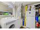 Convenient laundry room with washer, dryer, and extra storage at 4440 Sanibel Way, Bradenton, FL 34203