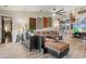 Living room with sectional sofa, wood-look floors, and eclectic decor at 4440 Sanibel Way, Bradenton, FL 34203