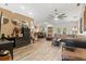 Spacious living room with large sectional sofa, wood-look floors, and ceiling fan at 4440 Sanibel Way, Bradenton, FL 34203
