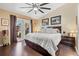 Main bedroom with sliding doors to the pool area and ceiling fan at 4440 Sanibel Way, Bradenton, FL 34203
