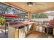 Fully equipped outdoor kitchen with grill and bar at 4440 Sanibel Way, Bradenton, FL 34203
