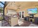 Outdoor kitchen with built-in grill, sink, and bar seating at 4440 Sanibel Way, Bradenton, FL 34203