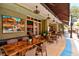Outdoor patio seating area with tables and chairs, located in front of a building at 4440 Sanibel Way, Bradenton, FL 34203