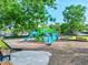 Community playground with playset, slides, and benches at 4440 Sanibel Way, Bradenton, FL 34203