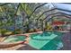 Enjoy this screened pool and spa with a relaxing patio area at 4440 Sanibel Way, Bradenton, FL 34203