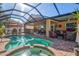 Large screened pool and spa with an outdoor entertainment area at 4440 Sanibel Way, Bradenton, FL 34203