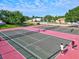 Tennis courts with two people playing at 4440 Sanibel Way, Bradenton, FL 34203