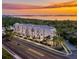 Aerial view of modern building at sunset, near water at 4950 Remington Dr # 403, Sarasota, FL 34234