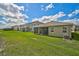 View of homes with fenced backyards and patios at 5282 Grove Mill Loop, Bradenton, FL 34211