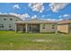 House with a large backyard and screened patio at 5282 Grove Mill Loop, Bradenton, FL 34211