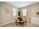 Small breakfast nook with round table and four chairs at 5282 Grove Mill Loop, Bradenton, FL 34211