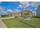 House exterior showcasing a two-car garage and well-maintained lawn at 5282 Grove Mill Loop, Bradenton, FL 34211