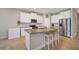 Modern kitchen with granite countertops and stainless steel appliances at 5282 Grove Mill Loop, Bradenton, FL 34211