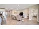 Living room with comfortable seating and large screen TV at 5282 Grove Mill Loop, Bradenton, FL 34211