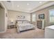 Bright main bedroom with carpeted floor, window shutters, and large dresser at 5282 Grove Mill Loop, Bradenton, FL 34211
