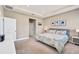 Main bedroom with carpeted floor, window shutters, and access to bathroom at 5282 Grove Mill Loop, Bradenton, FL 34211