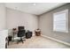 Home office with a desk, chair, and window with shutters at 5282 Grove Mill Loop, Bradenton, FL 34211