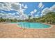 Resort-style pool with lounge chairs and shaded areas at 5282 Grove Mill Loop, Bradenton, FL 34211
