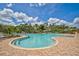 Relaxing kidney-shaped pool with surrounding patio at 5282 Grove Mill Loop, Bradenton, FL 34211