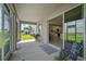 Spacious screened porch with a grill and views of the backyard at 5282 Grove Mill Loop, Bradenton, FL 34211