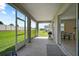 Relaxing screened porch with backyard and kitchen views at 5282 Grove Mill Loop, Bradenton, FL 34211