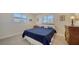 Cozy bedroom with a double bed, dresser, and window shutters at 5308 Coral Blvd, Bradenton, FL 34210